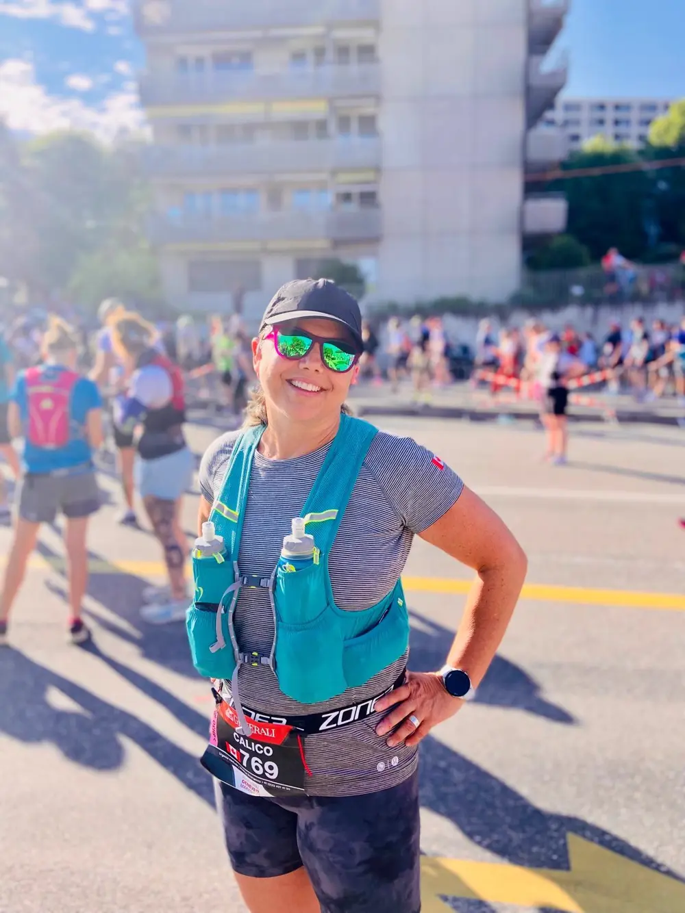 Runner smiling at the start line of a marathon