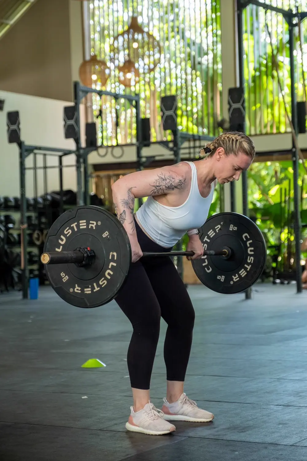 Woman lifting a barbell in the gym